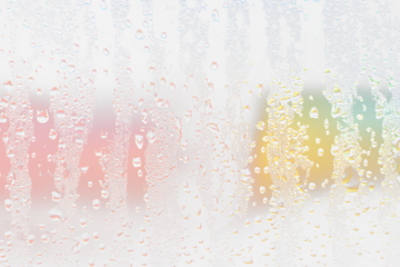 Condensation on glass with colorful blurred background.