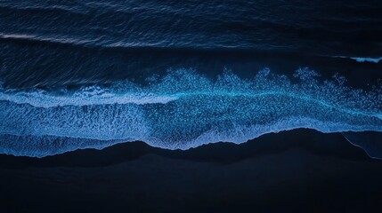 Surreal Drone View of Bioluminescent Waves Glowing in Nighttime Ocean Scene