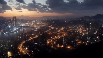 Naklejka premium A stunning cityscape at dusk, showcasing illuminated buildings and winding roads.