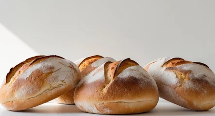 Fototapete a freshly baked loafs of bread with a golden brown crust © DEER FLUFFY