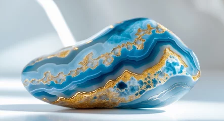 Fototapeten Closeup view of a lustrous blue and gold agate piece showcasing natural beauty © DEER FLUFFY