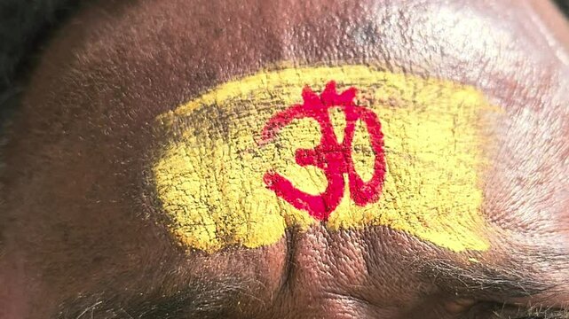 Omm tilak on forehead