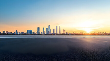 Obraz premium Golden Sunset Over a Modern City Skyline With Empty Asphalt Road in the Foreground