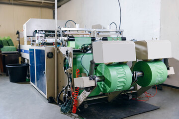 Industrial production of plastic packaging. Rollers with polyethylene bags for cut on machine