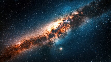 Fototapeta premium A mesmerizing view showcases a galaxy composed of bright stars and swirling cosmic dust against the backdrop of deep space. Colors blend to create a vibrant celestial tapestry