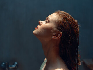 Contemplating life woman with wet hair gazing at sky from bathtub