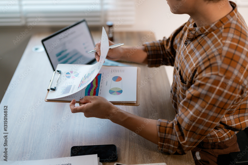 Aufkleber businessman working with documents analyzing financial data and economic growth reviewing statistics
