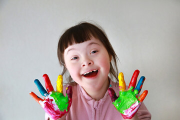 Cute little girl with painted hands