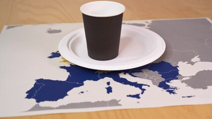 Disposable cups and plates sit on a map of europe, symbolizing the single-use plastics (sup) directive - Powered by Adobe