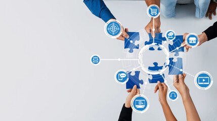 A top-down view of hands assembling puzzle pieces surrounded by technology icons, illustrating...