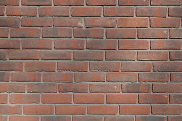 Fototapeta premium A brick wall with a red brick color