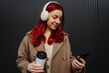 Portrait of a teenage girl smile and use cellphone to send text messages sms
