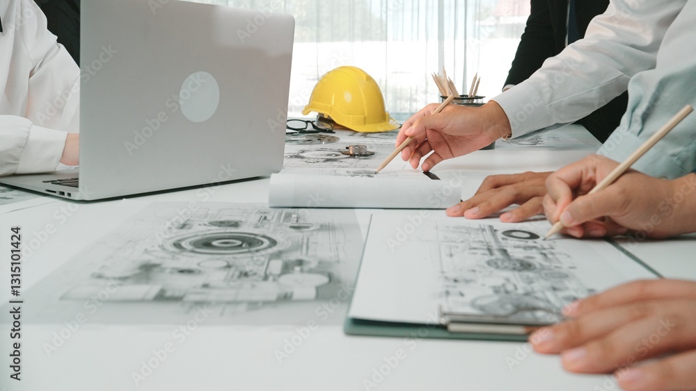 Poster a modern office scene showing engineers collaborating over blueprints and designs while utilizing la