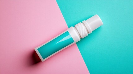 Teal spray bottle on pink & aqua background