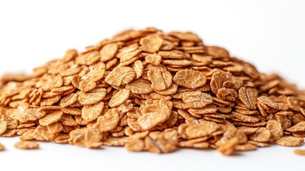 Pile of golden oat flakes on white background