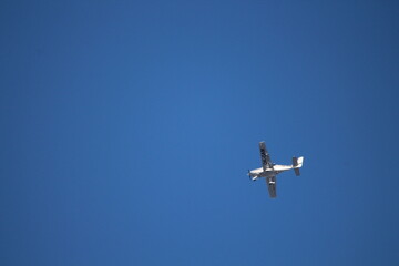 Plane in a flight on a blue sky background 