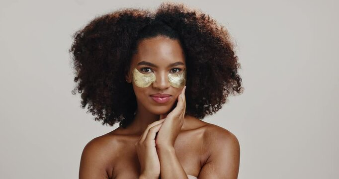 Cosmetics, eye patch with face of woman in studio for beauty, hydration and self care. Skincare, glow and dermatology with African person on white background for shine, spa treatment and facial