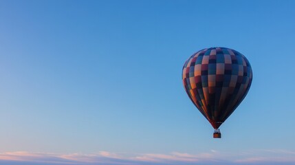 Obraz premium vibrant colorful hot air balloon partially inflates against clear sky capturing anticipation of flight with its array