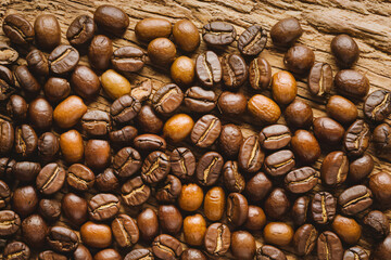 Roasted Coffee Beans on Rustic Wooden Background
