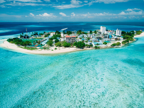 Gulhi island in Kaafu atoll. Local island with ocean in Maldives. Aerial View