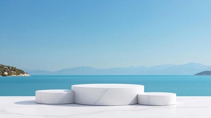 Naklejka premium White Marble Podium Displaying Products Overlooking Coastal Sea and Blue Sky