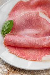 Ham slices pork meat delicious gourmet food background on the table rustic food top view copy space