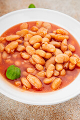White bean tomato sauce delicious gourmet food background on the table rustic food top view copy space keto and paleo diet vegetarian and vegan food