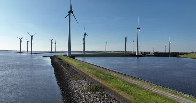 windmills, wind turbines at the Krammersluizen, locks and sluice complex, waterway infrastructure in Zeeland, The Netherlands.