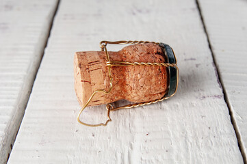 Champagne cork close up on a wooden background