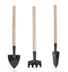 Garden shovels and rake isolated on a white background
