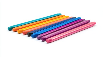 Fototapeta premium A set of colorful pencils arranged neatly on a white isolated background