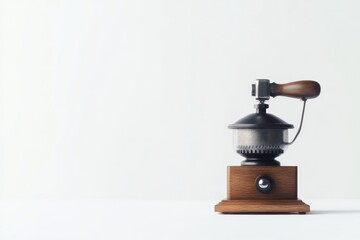 minimalist arrangement showcasing vintage coffee grinder on white backdrop gears and handle in focus crafted wood and