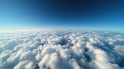 Fototapeta premium Endless Stretch of Heavenly Clouds Beneath a Gradient Sky at High Altitude