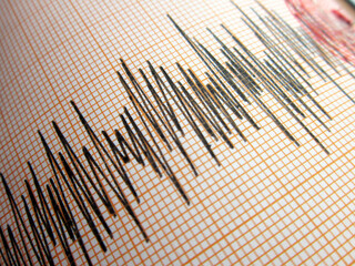 Seismograph and earthquake. A seismograph that records the seismic activity of an earthquake.