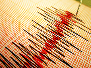 Seismograph and earthquake. A seismograph that records the seismic activity of an earthquake.