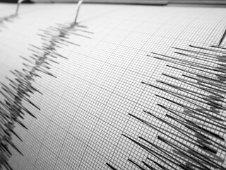 Seismograph and earthquake. A seismograph that records the seismic activity of an earthquake.