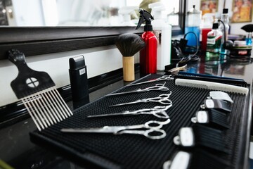 Professional barber tools arranged neatly on a salon counter