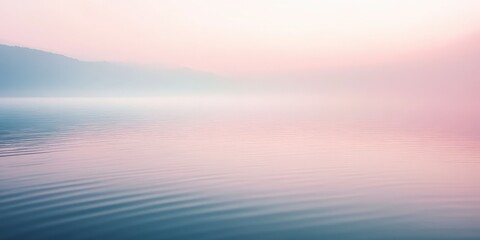 Serene pink and blue lakeside morning landscape with distant hills