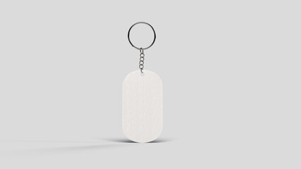 Gray metal keyring suspended in a white backdrop