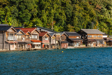 Fototapeta premium Beautiful later afternoon sight in Ine Bay, with the typical Funaya boat houses. Kyoto, Japan.
