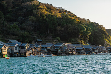 Beautiful later afternoon sight in Ine Bay, with the typical Funaya boat houses. Kyoto, Japan.