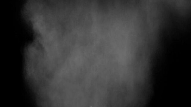 A dense heavy blizzard snowstorm VFX insert in slow-motion on black screen. Black screen Christmas snowstorm. Particles swirling moved by wind. Snow is moving through space. Snowstorm on black.