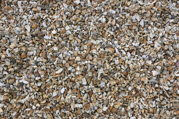 A pile of gravel with a lot of white and brown rocks