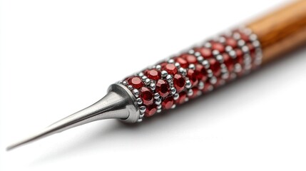 Close-up of a decorated nail art tip on white background