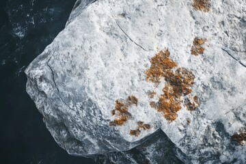 Coastal rock outcrop, top-down view,  watery backdrop.  Possible use nature, travel, or environmental