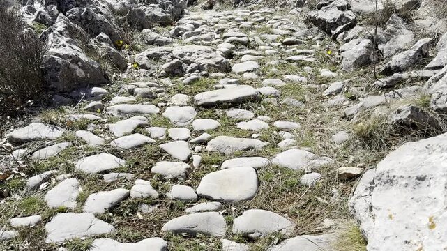 Historical royal road, stone paved roman road texture