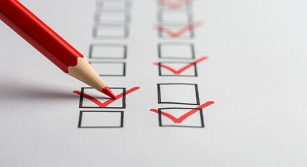 Red pencil checking boxes on a to-do list, symbolizing productivity and organization.