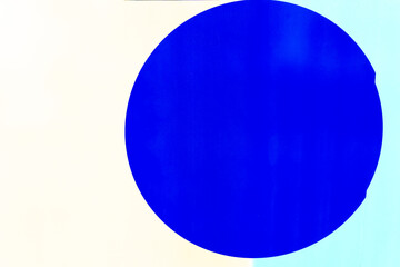 Bold blue circle on a light background creates an eye-catching abstract design