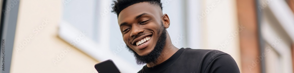 Poster a man with a beard is smiling and holding a cell phone. he is looking at the screen and he is enjoyi