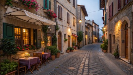 Obraz premium Charming cobblestone street illuminated at dusk in a historic Italian village